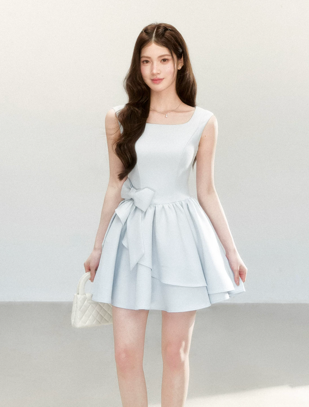 QDQD Sweet and feminine summer dress with bow design, slim waist and princess camisole style.