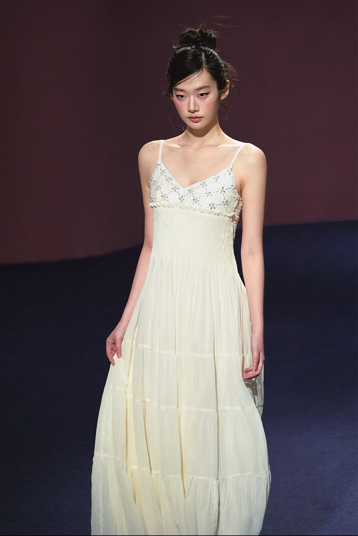 A white sequined V-neck dress in a holiday style.