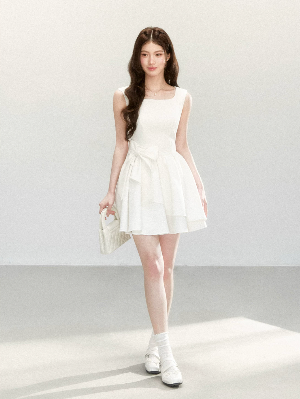 QDQD Sweet and feminine summer dress with bow design, slim waist and princess camisole style.