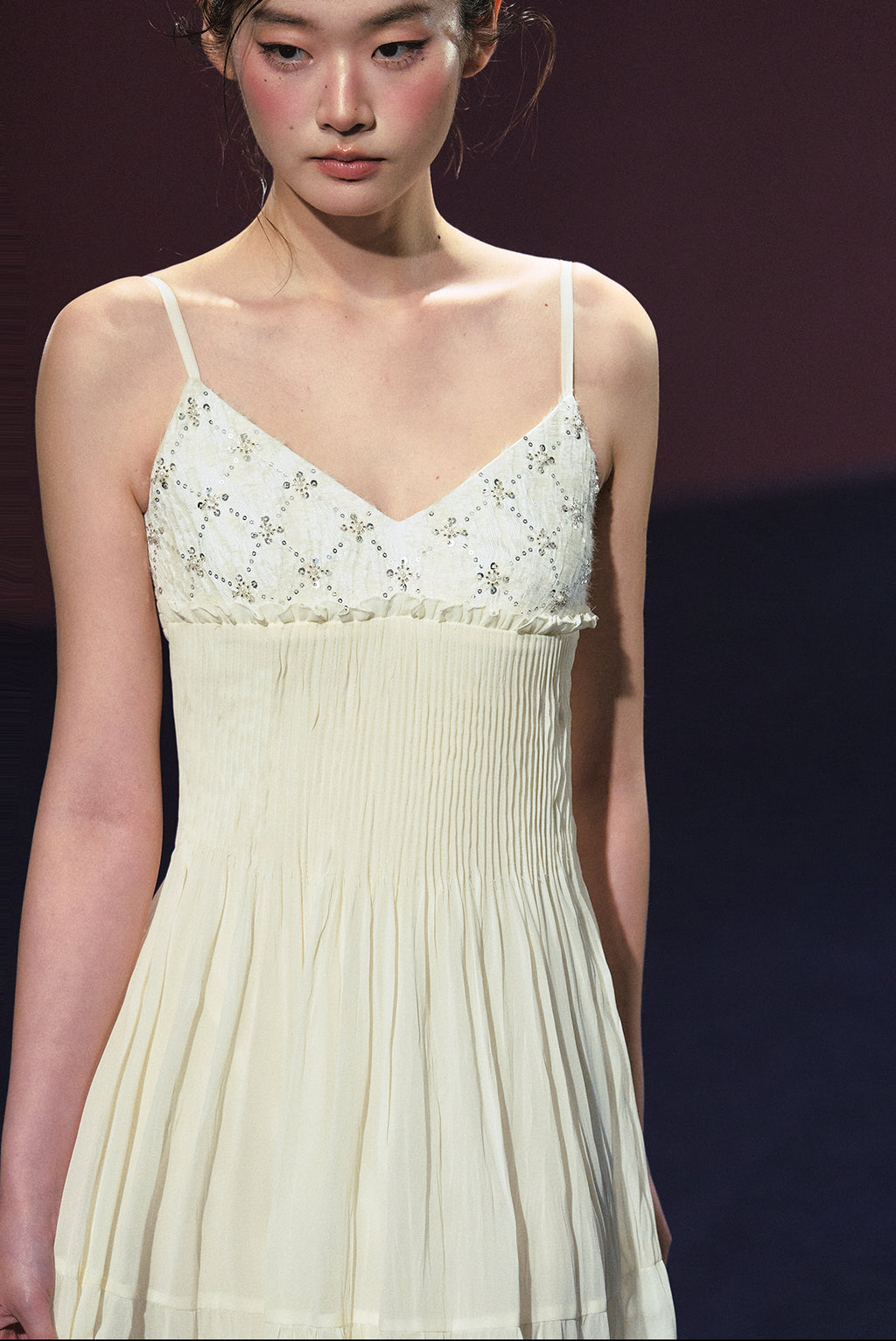 A white sequined V-neck dress in a holiday style.