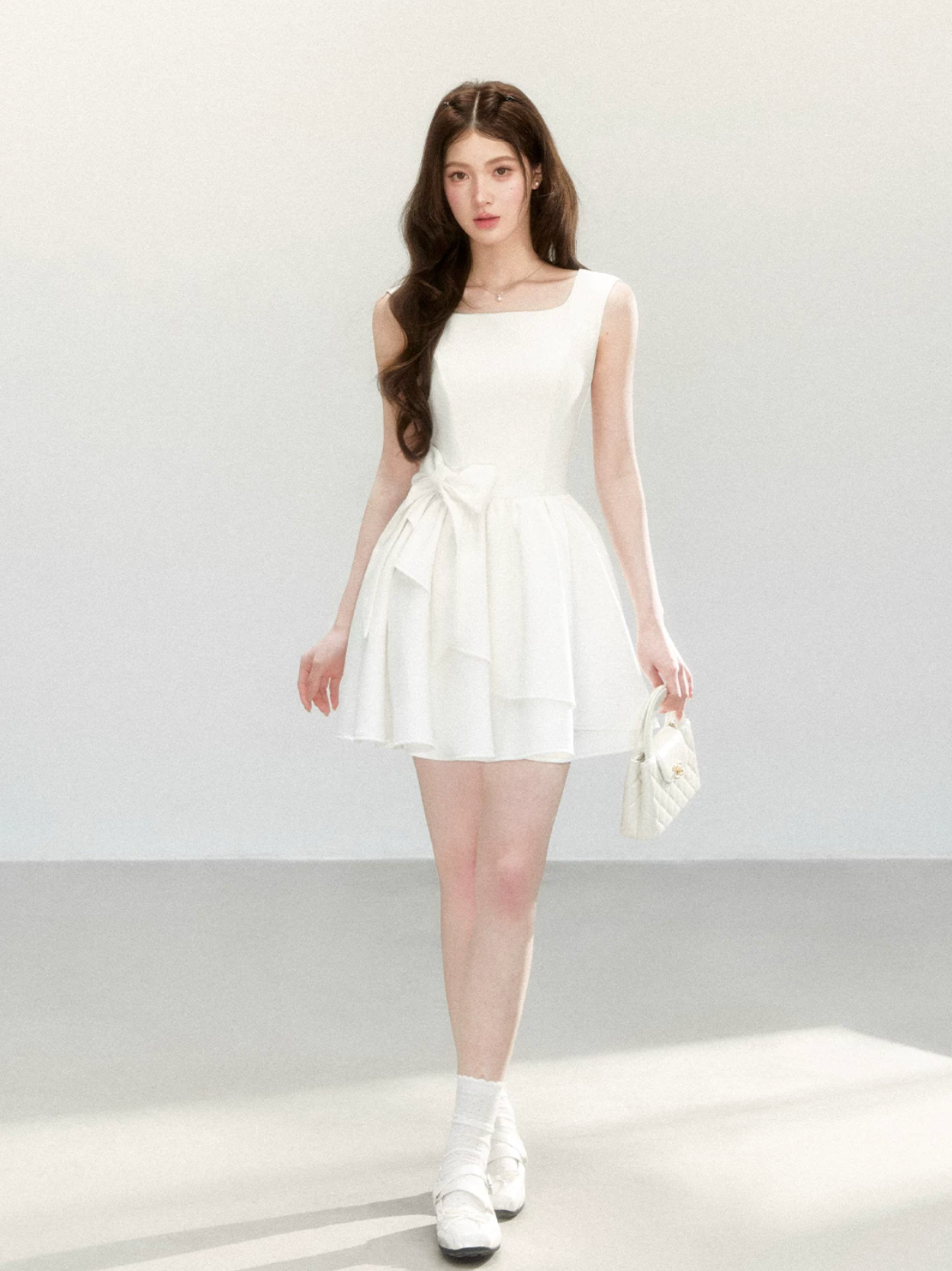 QDQD Sweet and feminine summer dress with bow design, slim waist and princess camisole style.