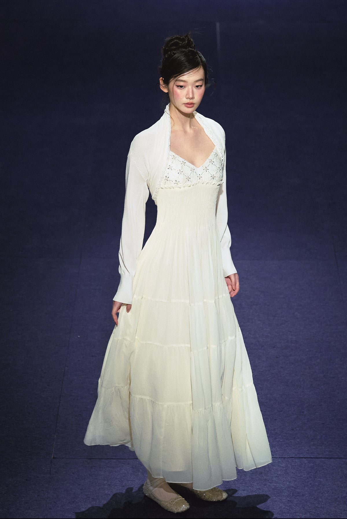 A white sequined V-neck dress in a holiday style.