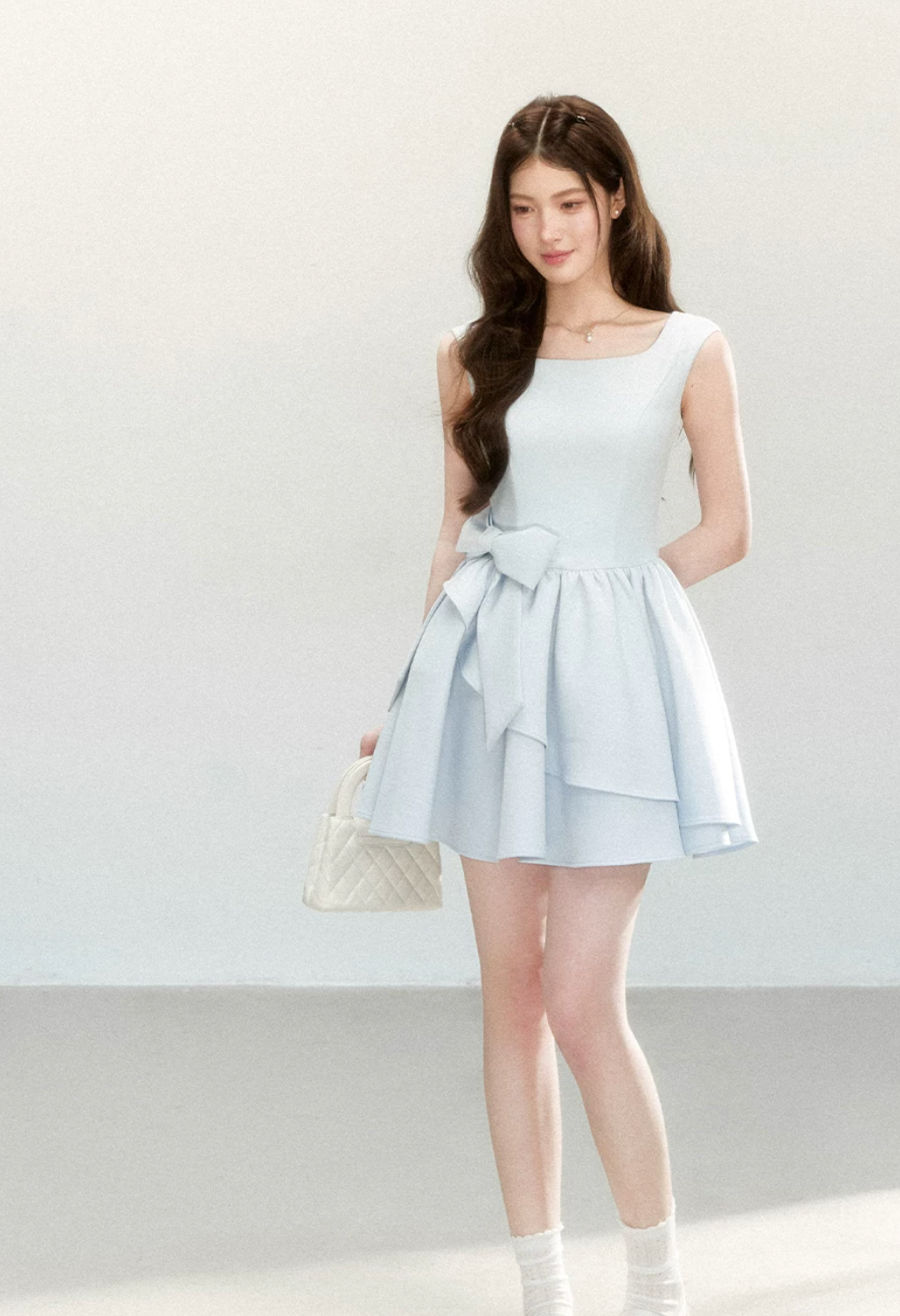 QDQD Sweet and feminine summer dress with bow design, slim waist and princess camisole style.
