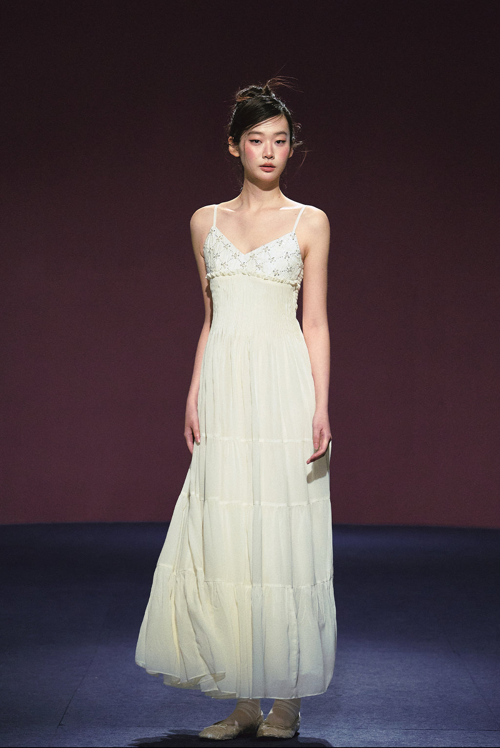 A white sequined V-neck dress in a holiday style.