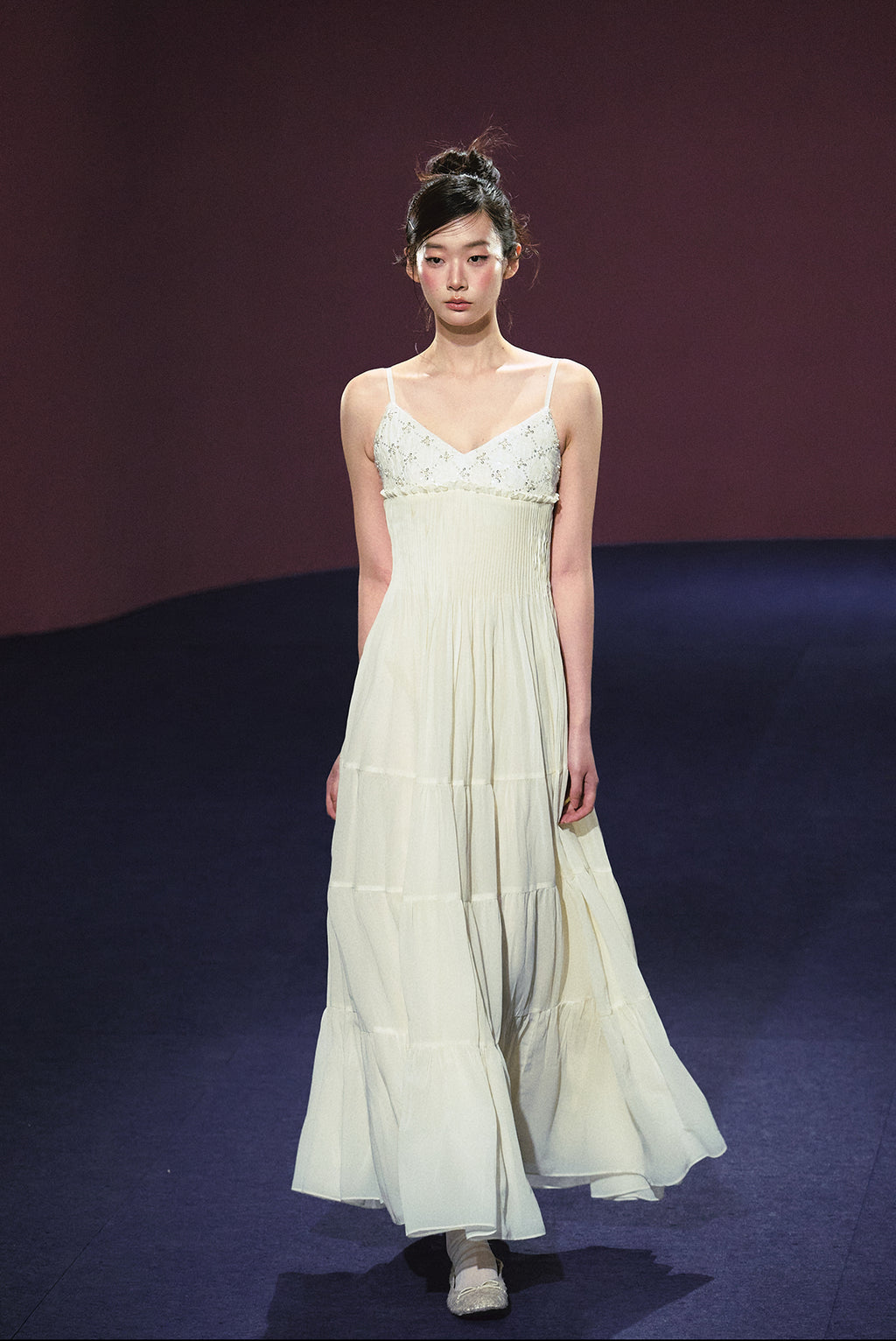 A white sequined V-neck dress in a holiday style.