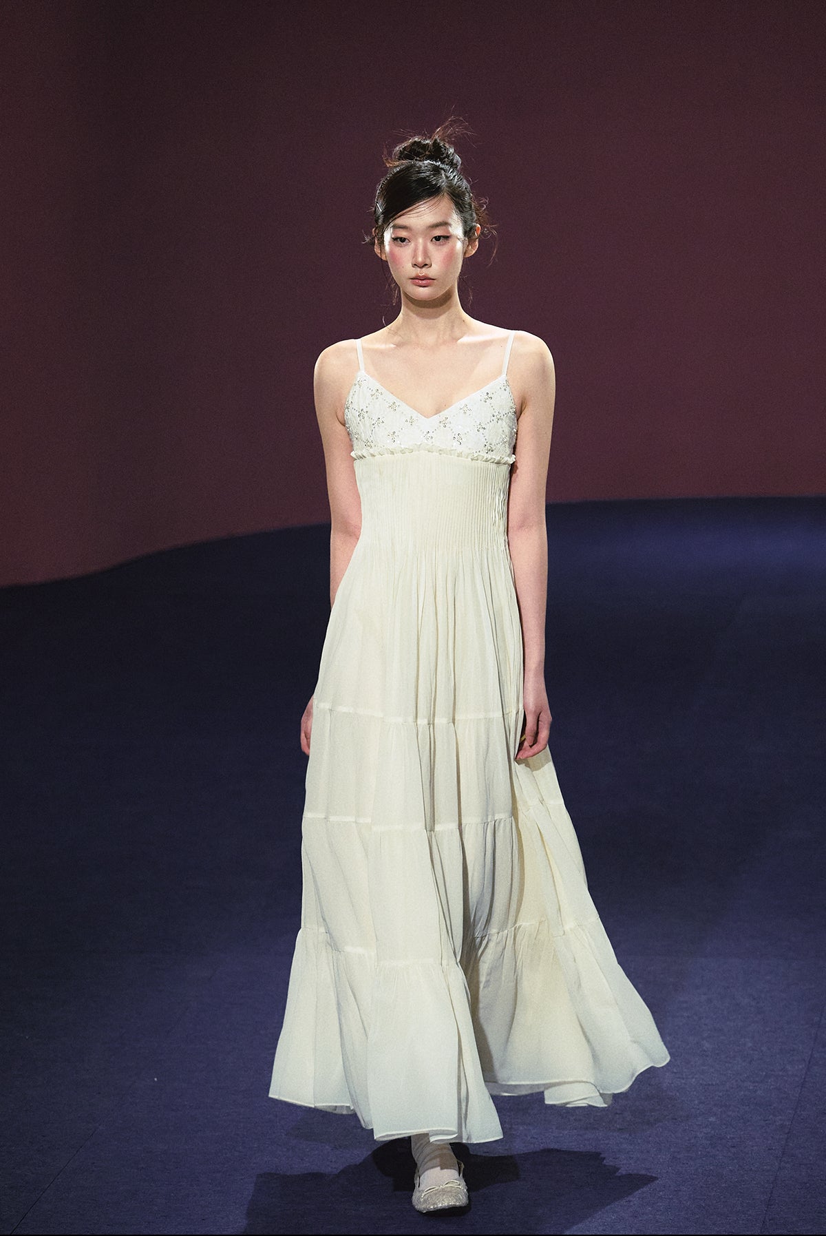 A white sequined V-neck dress in a holiday style.