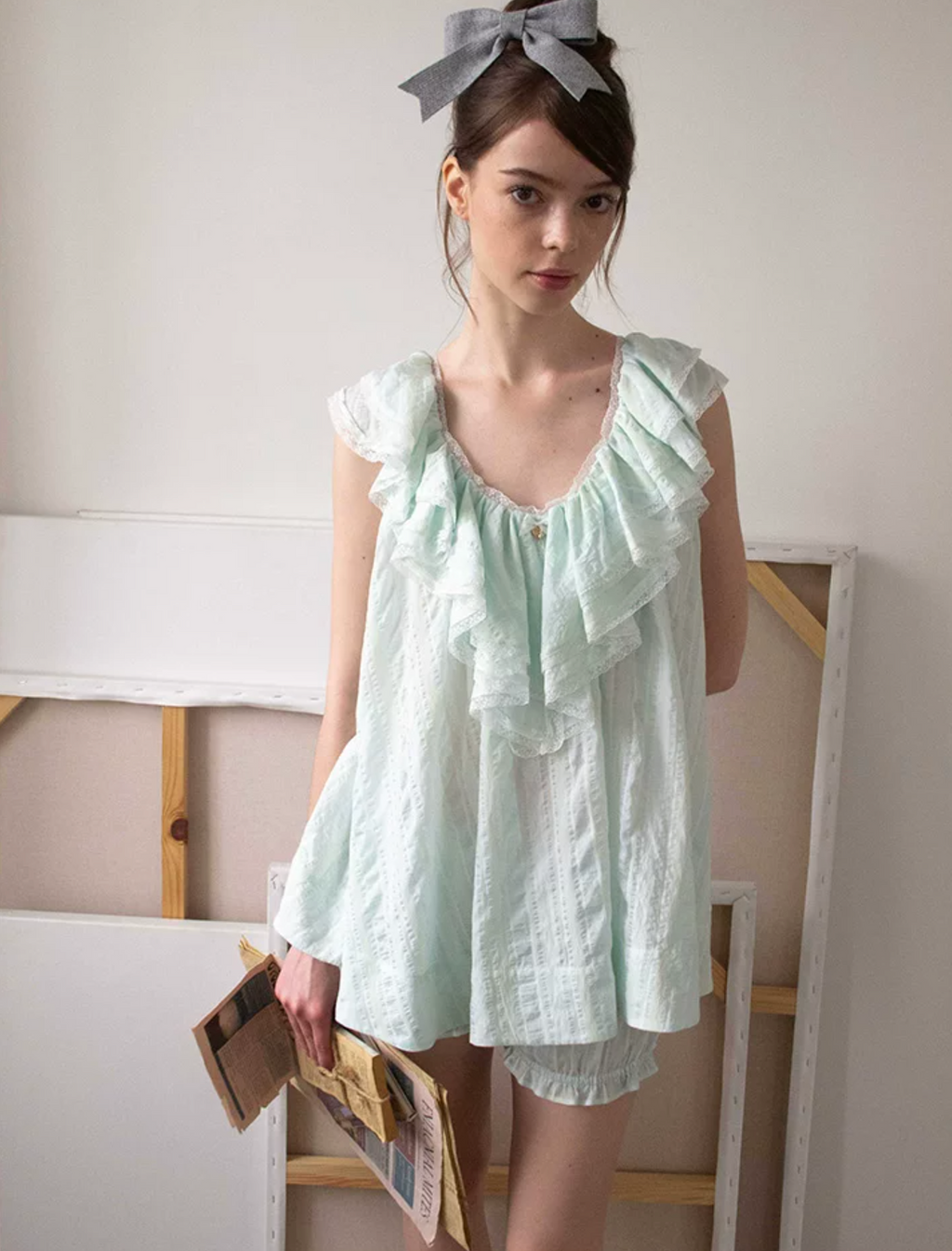 MineBeThyVers Loose-fitting ruffled layered lace mint green suit and pumpkin shorts.