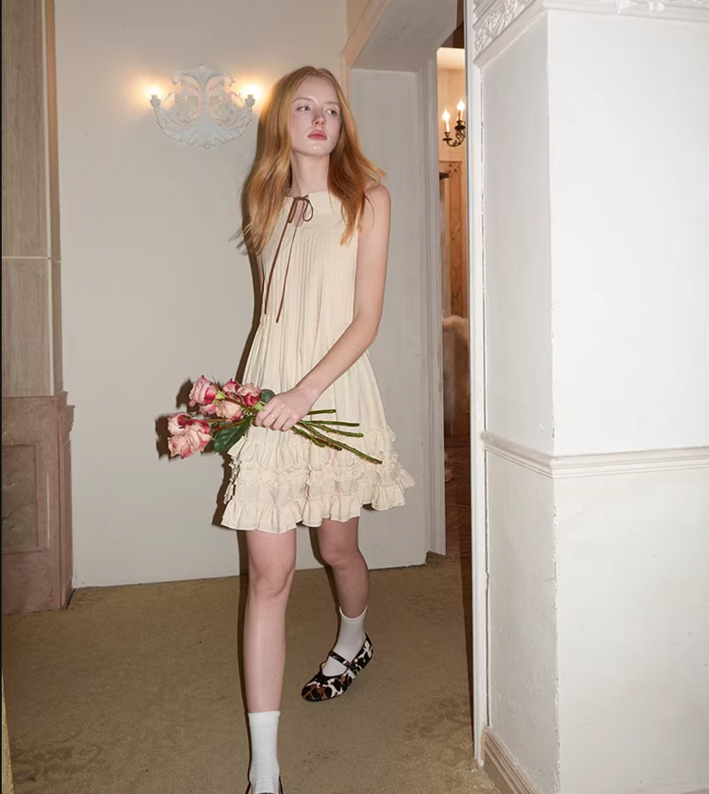 UENA Light yellow round neck sleeveless vest dress with ruffles at the bust and babydoll collar