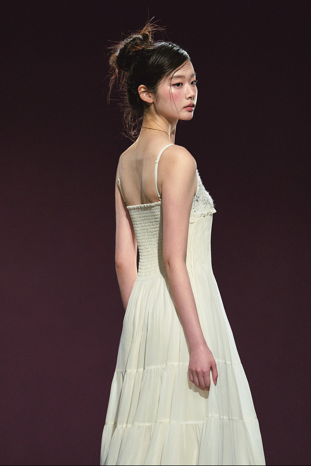 A white sequined V-neck dress in a holiday style.