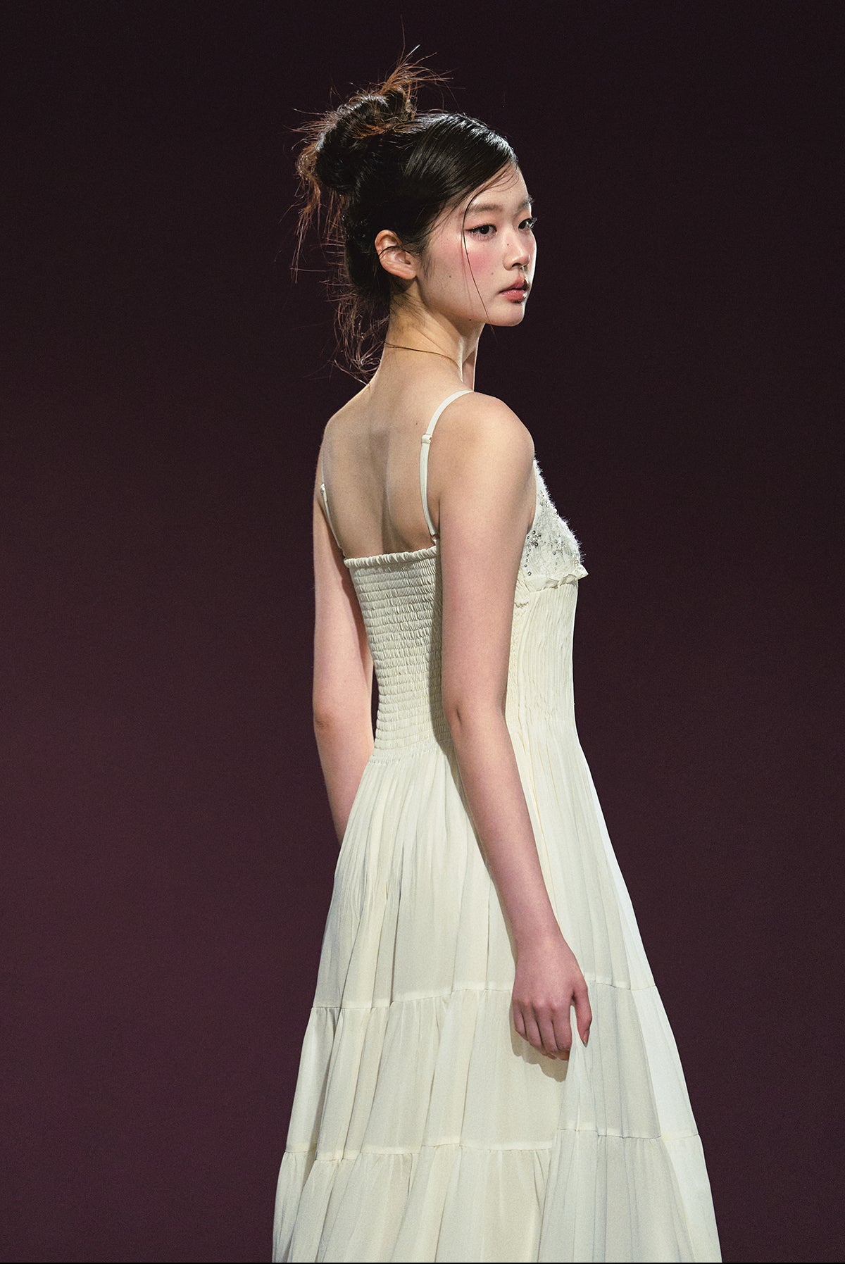 A white sequined V-neck dress in a holiday style.