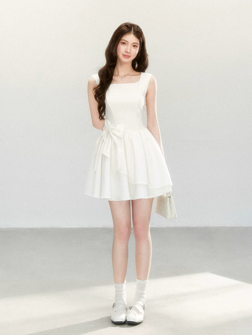QDQD Sweet and feminine summer dress with bow design, slim waist and princess camisole style.