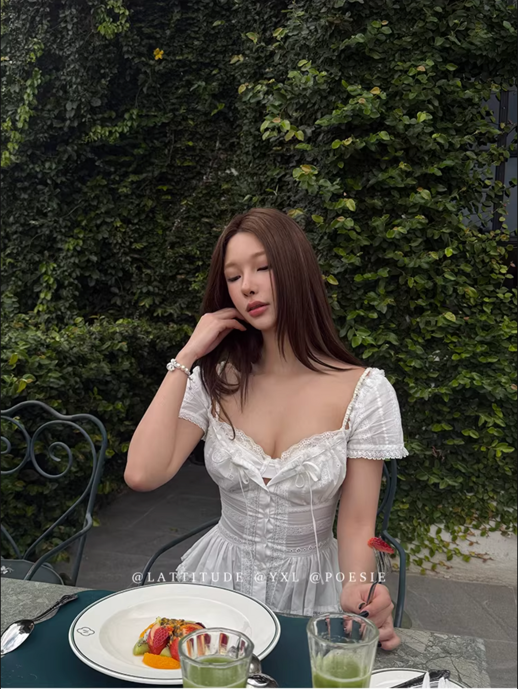 LATTITUDE White short-sleeved shirt with feminine hollow out lace trim.