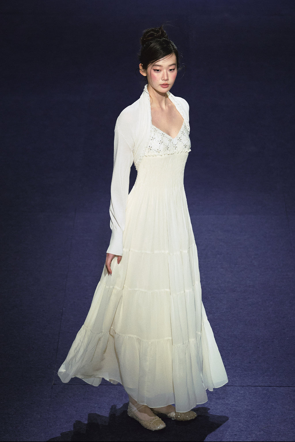 A white sequined V-neck dress in a holiday style.