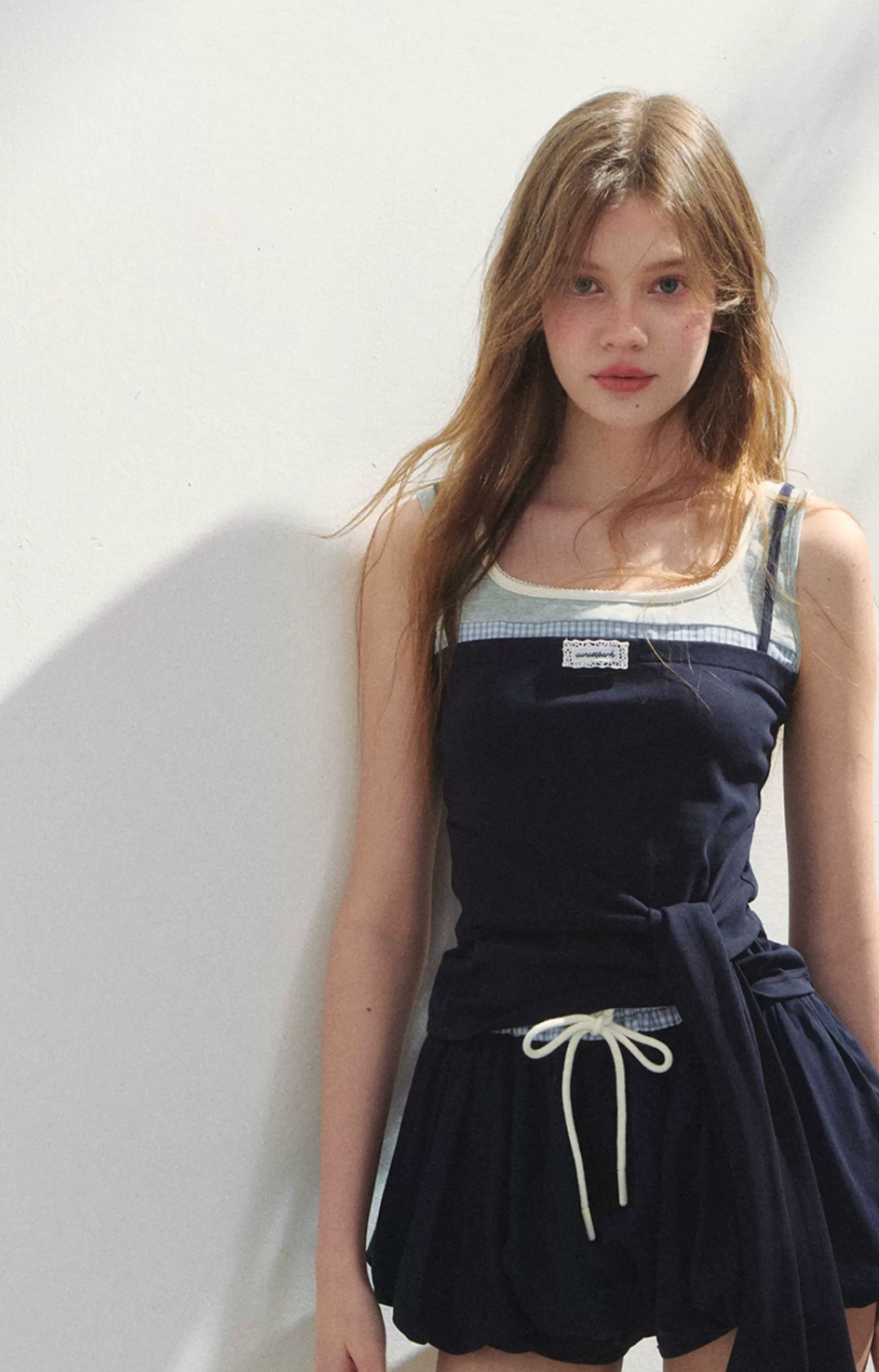SUNSETPARK A playful, feminine lyocell tulip dress.