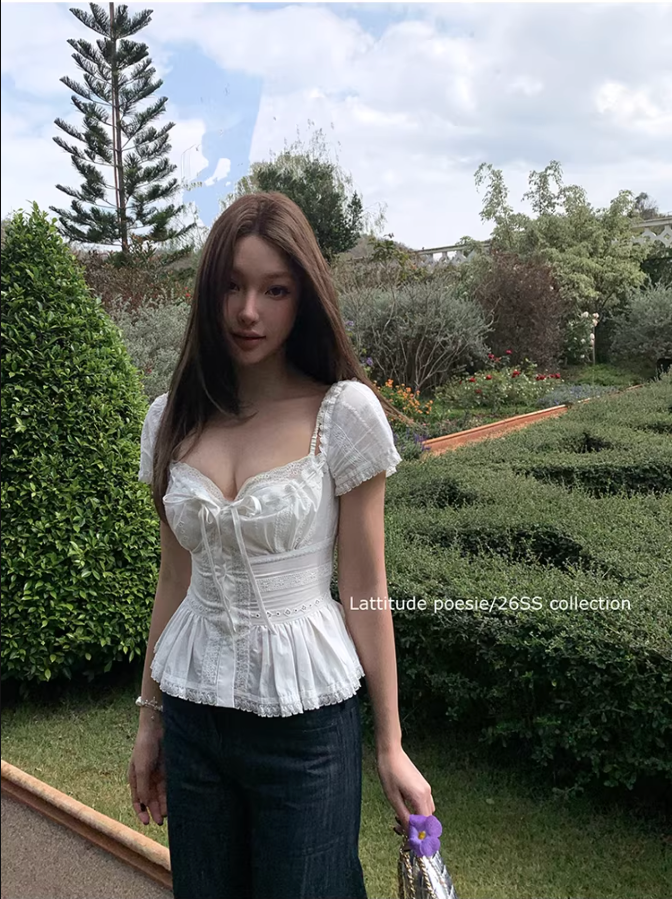 LATTITUDE White short-sleeved shirt with feminine hollow out lace trim.