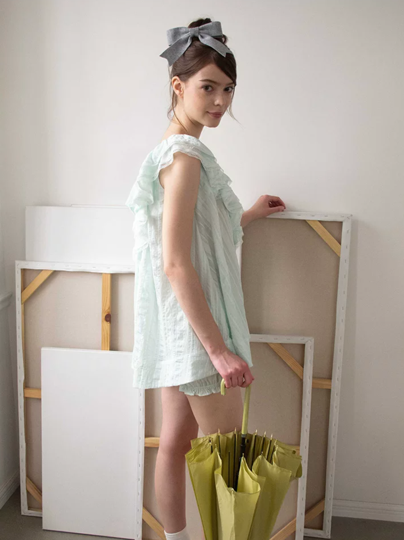 MineBeThyVers Loose-fitting ruffled layered lace mint green suit and pumpkin shorts.