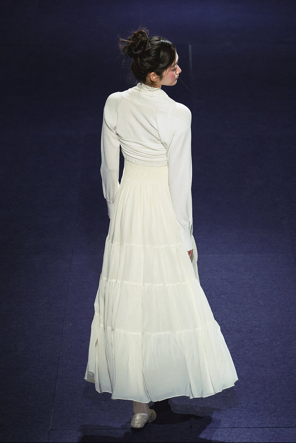 A white sequined V-neck dress in a holiday style.