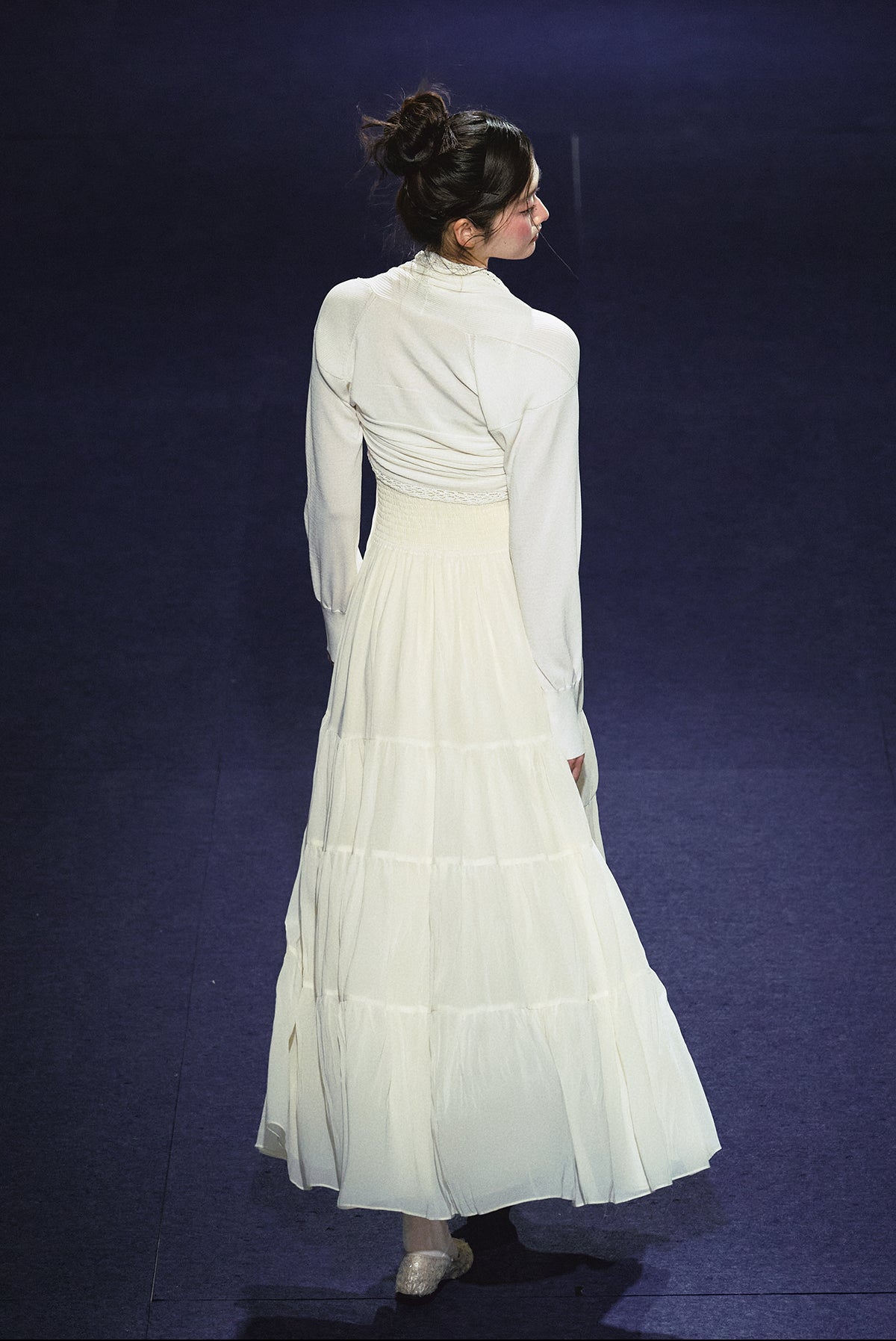 A white sequined V-neck dress in a holiday style.