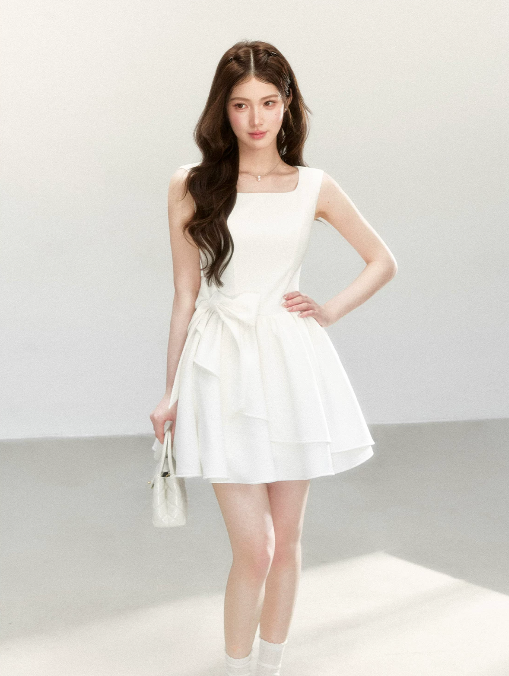 QDQD Sweet and feminine summer dress with bow design, slim waist and princess camisole style.