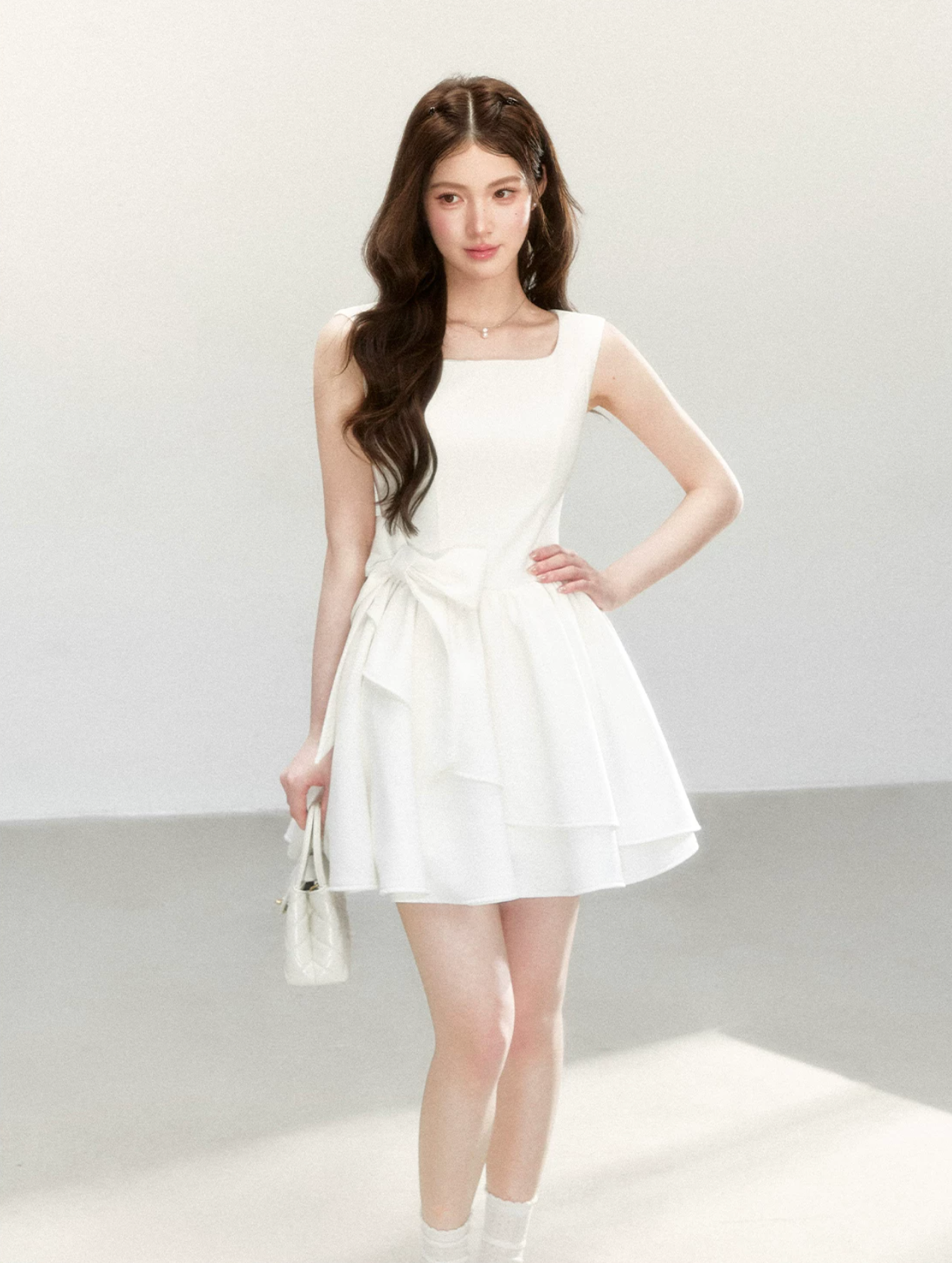 QDQD Sweet and feminine summer dress with bow design, slim waist and princess camisole style.
