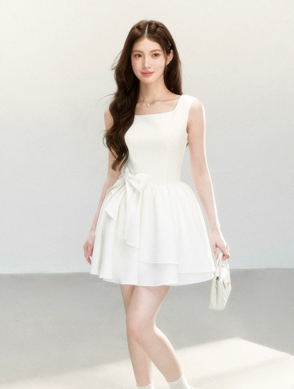 QDQD Sweet and feminine summer dress with bow design, slim waist and princess camisole style.