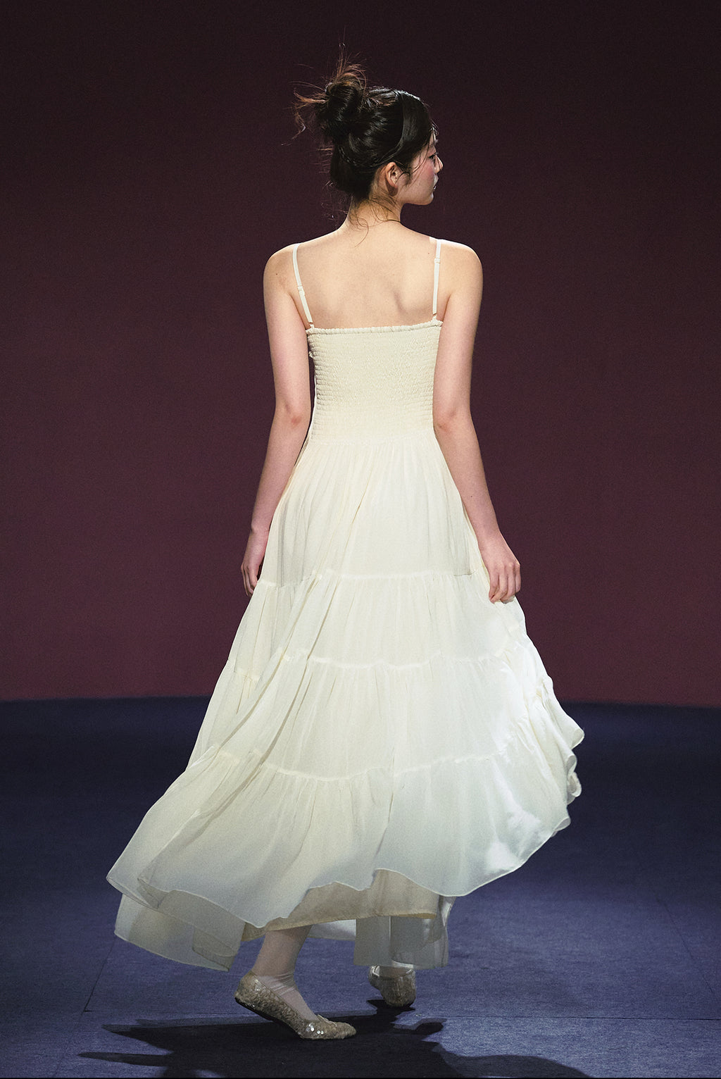 A white sequined V-neck dress in a holiday style.